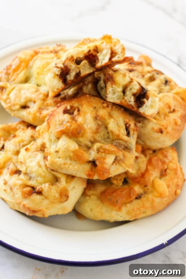 Vegemite Cheese Pinwheels 3 a plate of cheese and vegemite scrolls.