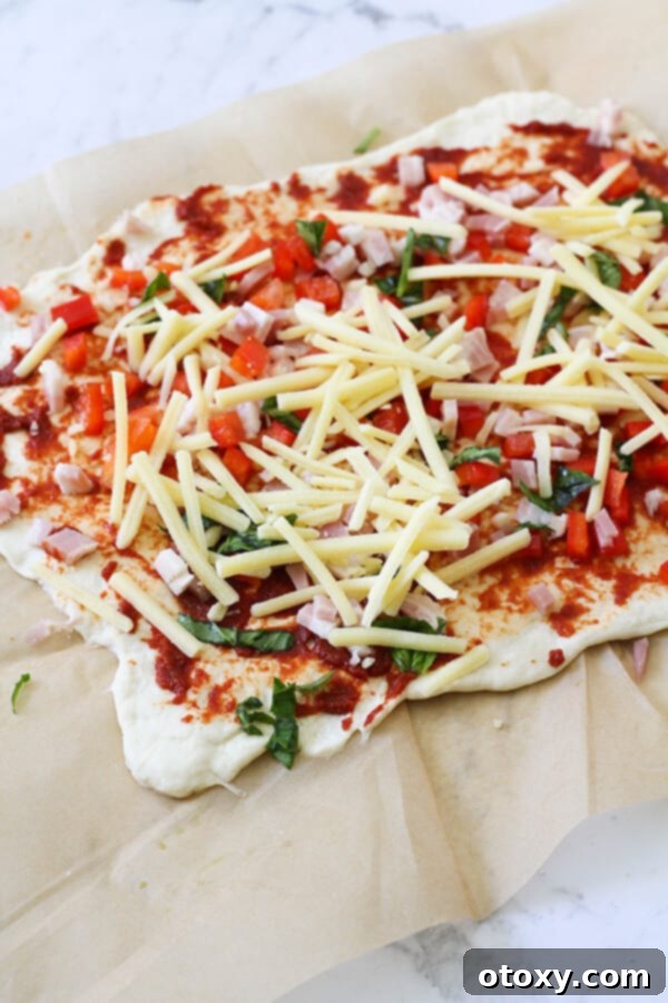 Pizza Pinwheels 7 dough covered in pizza ingredients.