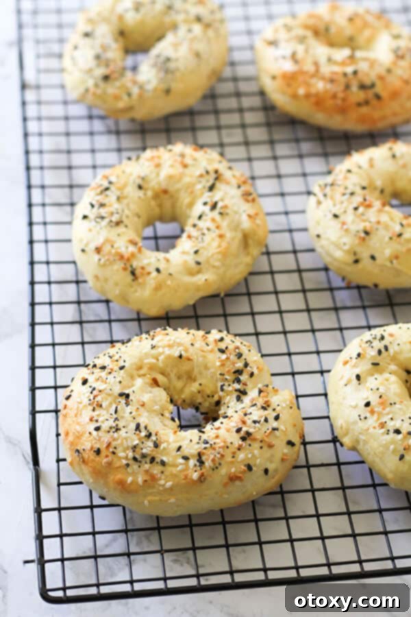 Speedy Yeast Free Bagels 10 Two ingredient bagels freshly baked and cooling on a wire rack, ready for serving.