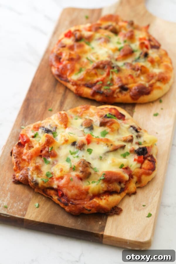 Close-up of a supreme pizza with perfectly layered toppings, ready to be enjoyed.