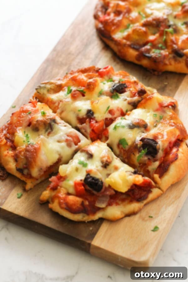 A final shot of supreme pizza slices on a wooden cutting board, ready to be served.