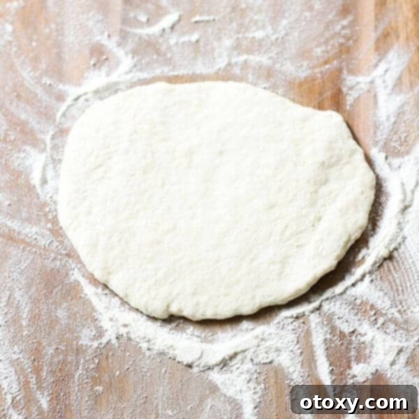 Two-ingredient dough, a perfect base for countless recipes, showing its soft, pliable texture ready for use.