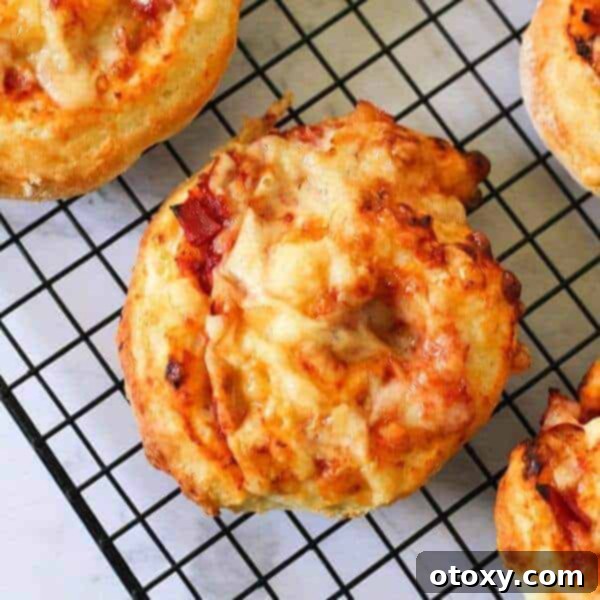 Golden-baked ham and cheese scrolls, filled with savory ham, melted cheese, and a hint of pineapple, perfect for snacks.