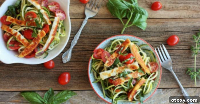 A plate of Fried Halloumi with Bruschetta Zoodles, a healthy one-pan dinner.