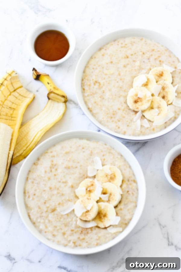 two bowls of steel cut oats topped with banana slices