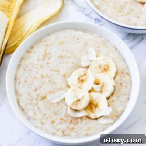 two bowls of banana maple steel cut oats topped with banana slices