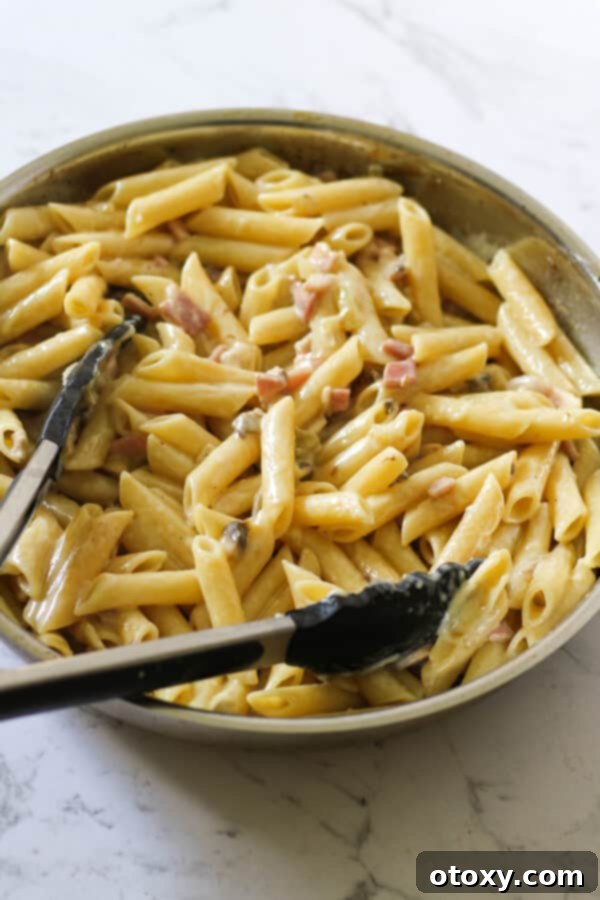 Creamy Carbonara in a frying pan, ready to be served.