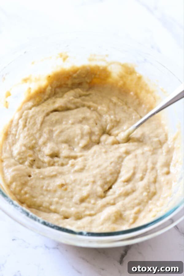 Velvety Buttermilk Banana Bread 7 Buttermilk Banana Bread batter, perfectly mixed, in a glass bowl, ready to be poured into the loaf pan.