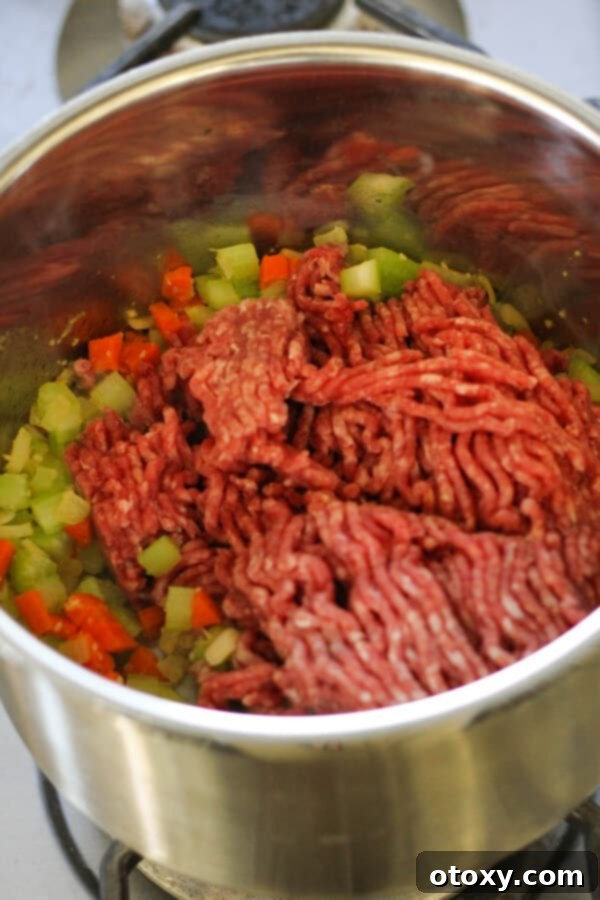 Step by step photo instructions showing beef mince browning in a saucepan with vegetables.