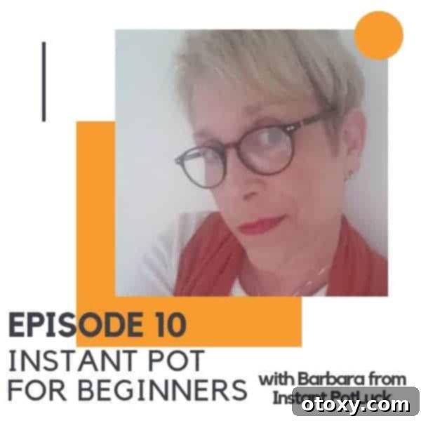 Close up image of a woman with glasses, a white shirt and a red scarf.