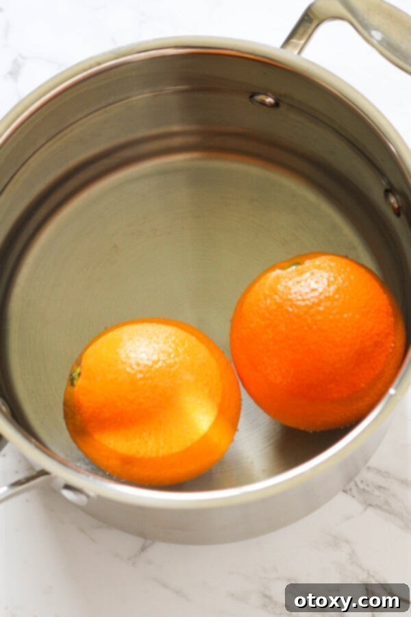 Zesty Orange Almond Tea Cakes 4 Step by step photo instructions on how to boil oranges for the cake mixture.