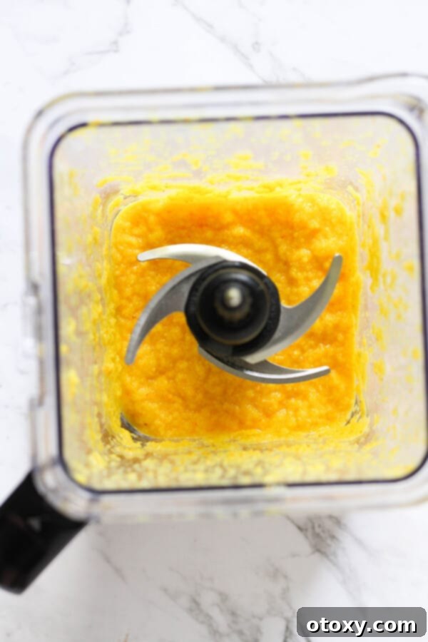 Zesty Orange Almond Tea Cakes 6 Step by step photo instructions showing blended orange puree in a food processor.