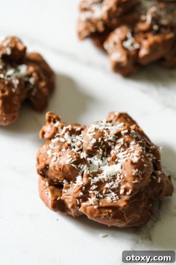 chocolate covered almonds on a marble background.