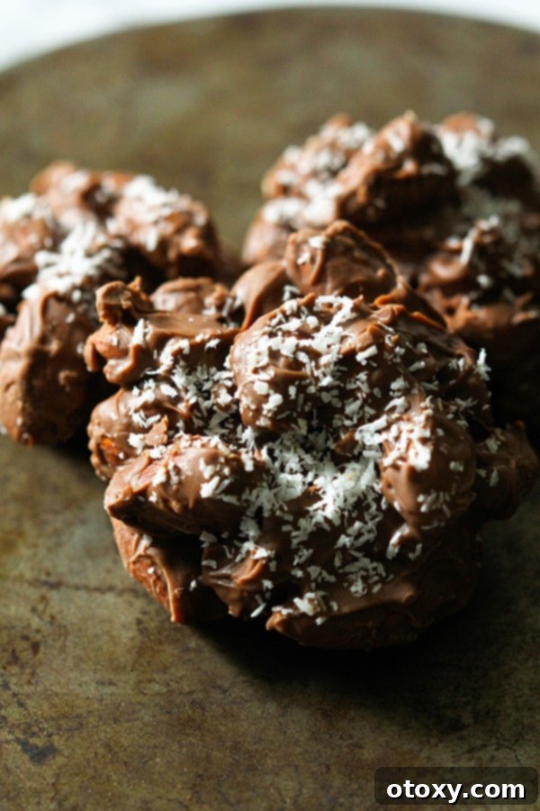 chocolate covered almonds on a rusted baking dish.