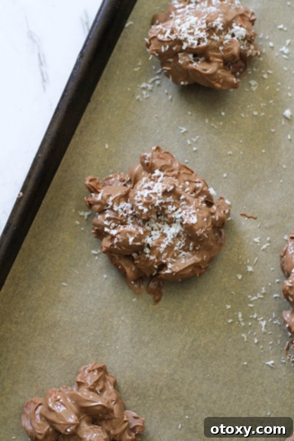 close up of a chocolate almond cluster on a baking tray