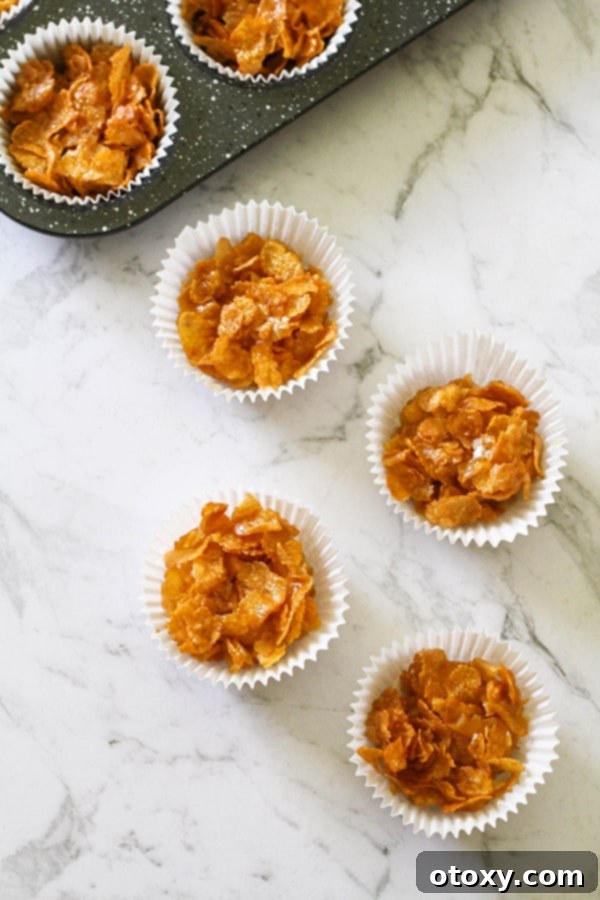 Honey joys in white paper liners on a marble background. 