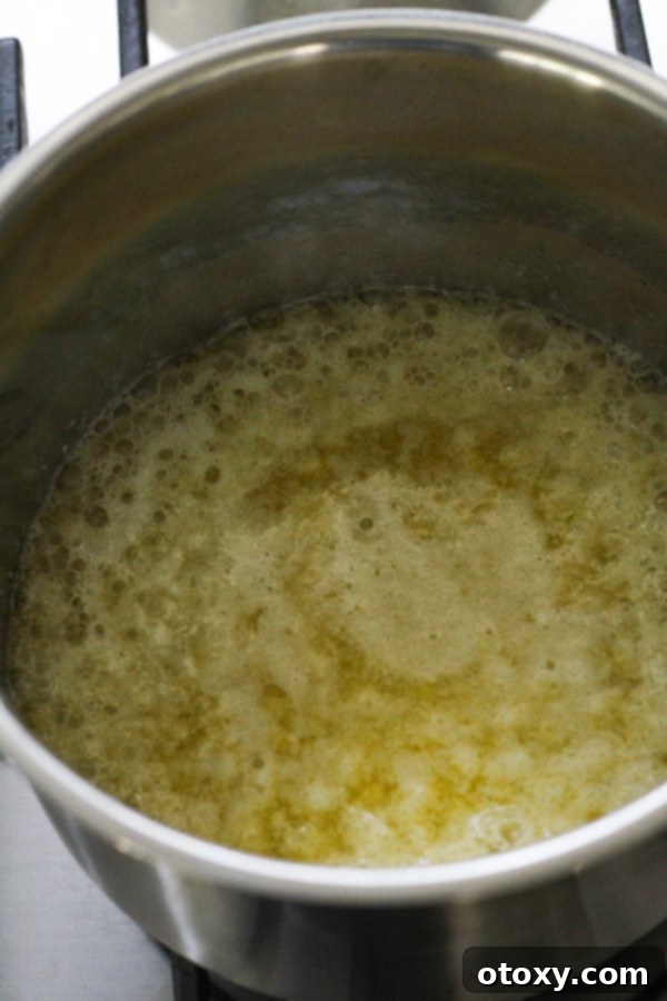 Butter melted in a saucepan.