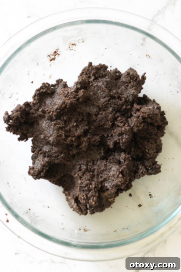 Creamy Oreo Cheesecake Truffles 6 oreo ball ingredients mixed together in a bowl.