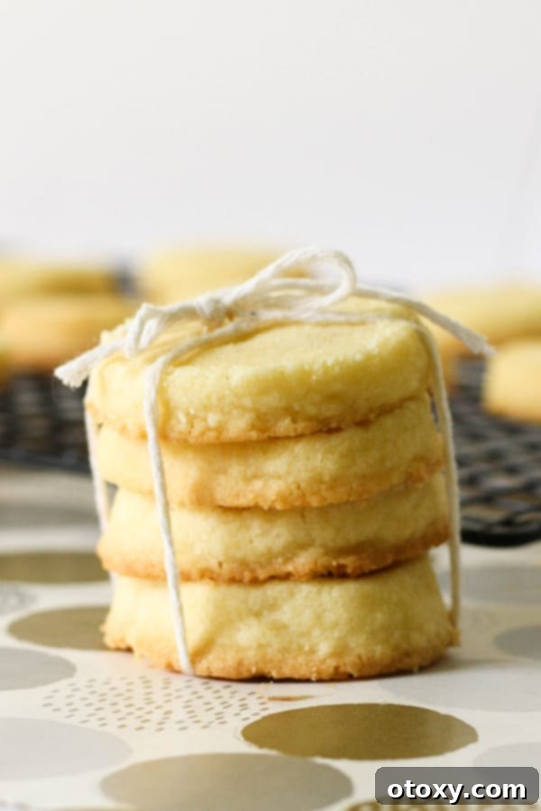 Another enticing stack of shortbread cookies on a wire rack, ready for storage or immediate enjoyment.