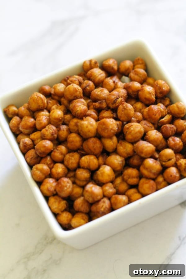 Another perspective of crispy chickpeas presented in a clean white bowl, highlighting their golden texture.