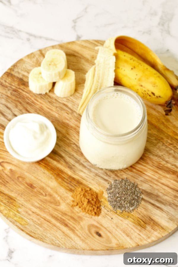 Creamy Chia Banana Blend 3 ingredients for chia banana smoothie laid out on wooden board
