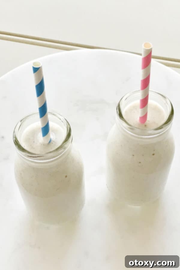 Creamy Chia Banana Blend 5 two small milk bottles filled with chia banana smoothie