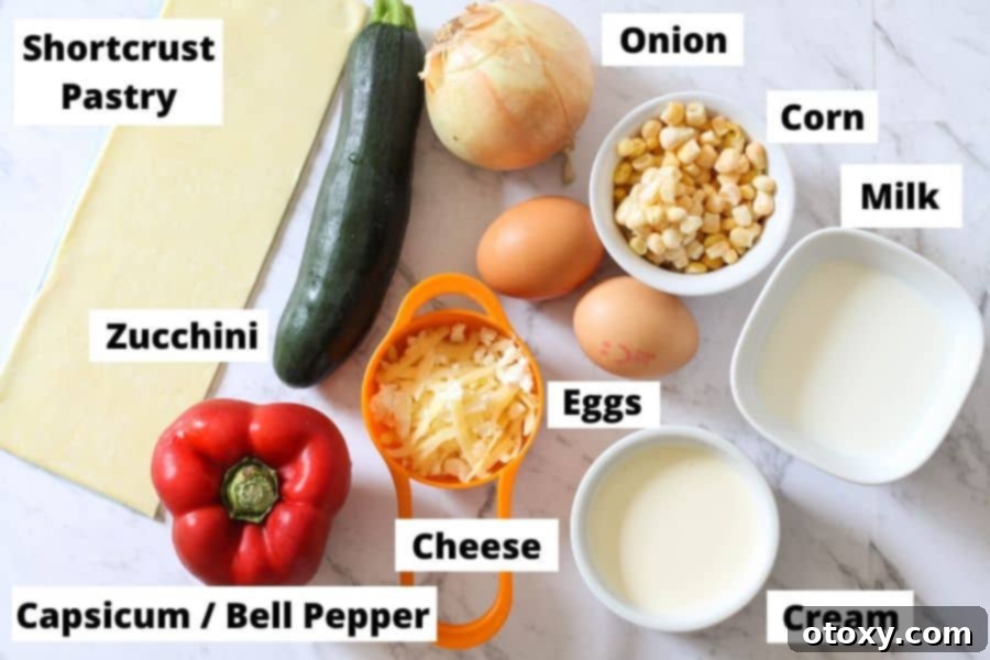 Fresh Garden Quiche 4 A flat lay of fresh ingredients for vegetarian quiche artfully arranged on a white marble background.