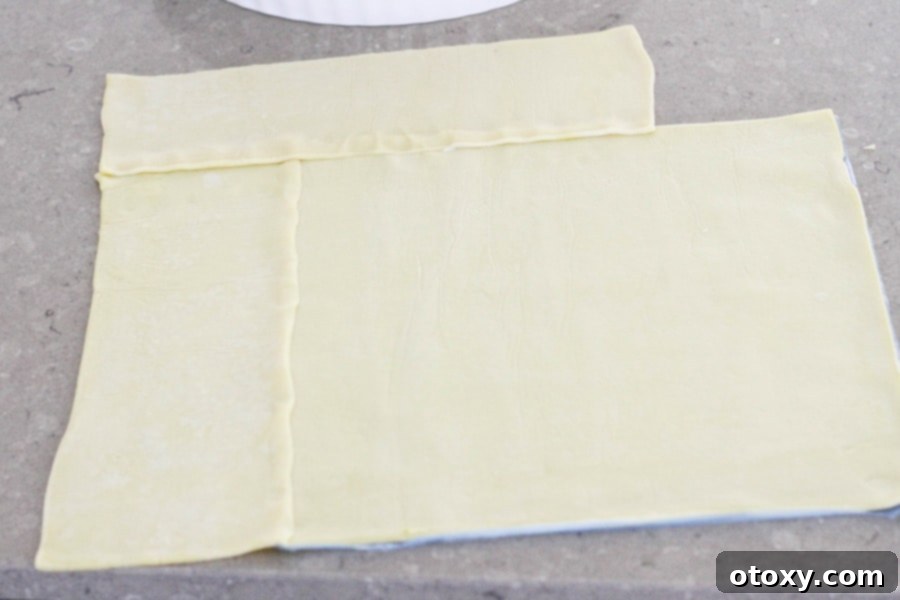 Fresh Garden Quiche 5 Two sheets of shortcrust pastry overlapping on a kitchen bench, preparing for the quiche tin.