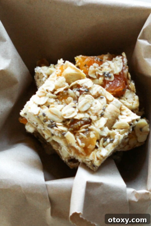 Effortless Chewy Apricot Granola Bars 6 chewy apricot muesli bars stacked on top of each other
