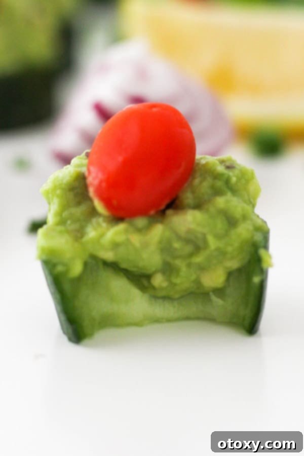 cucumber canape with a bite removed.