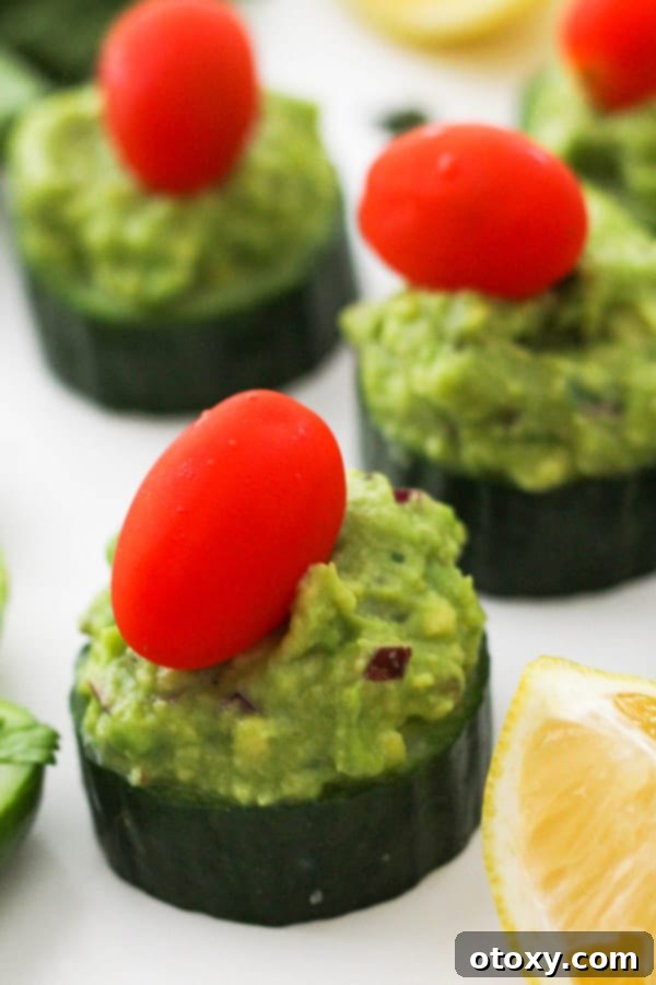 cucumber canapes on a white table.