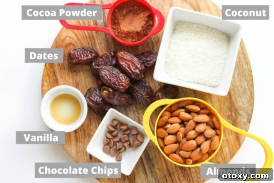 ingredients laid out on a wooden board, ready to make chocolate coconut energy balls.